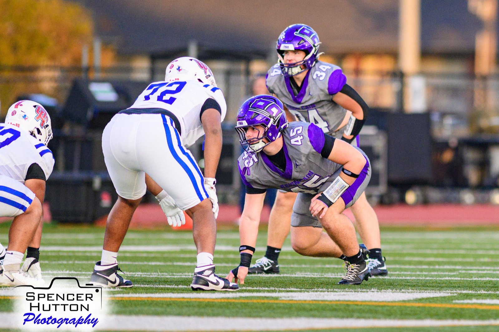 Senior defensive lineman Christian Lovell and senior linebacker Gage Hansberger in stance before the snap