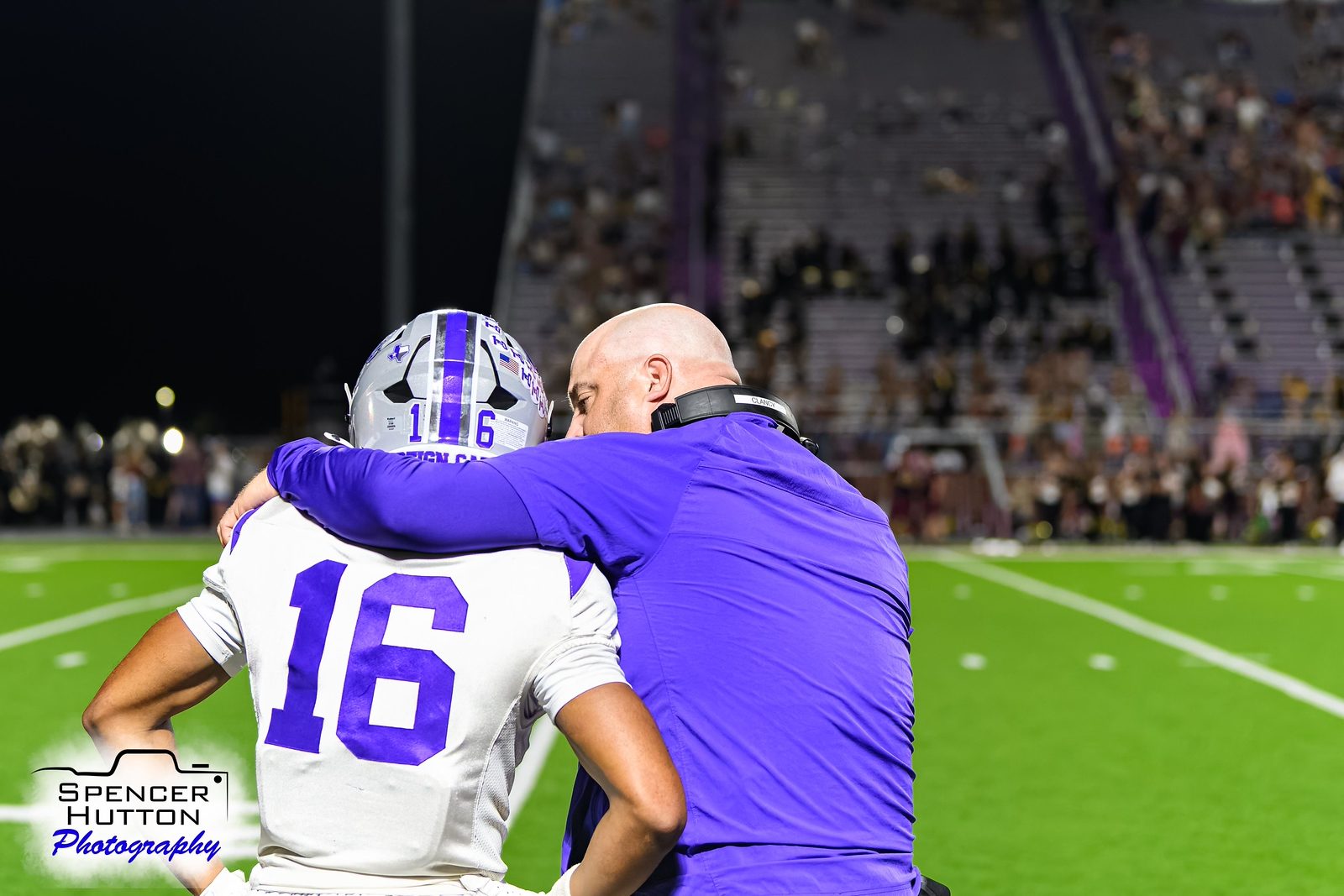 Head coach James Clancy embraces Eyan Johnson after the final whistle
