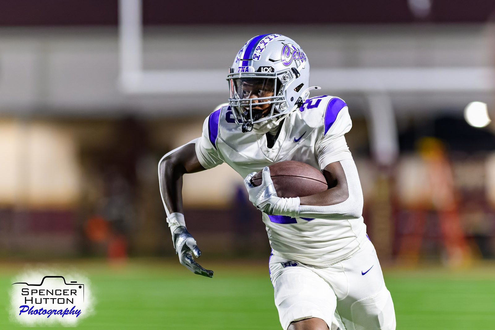 Junior running back Braylon Francis breaks into the secondary under the lights