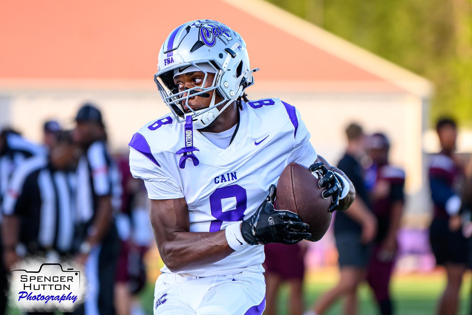 Sophomore wide receiver Israel Smith tucks the ball after the catch
