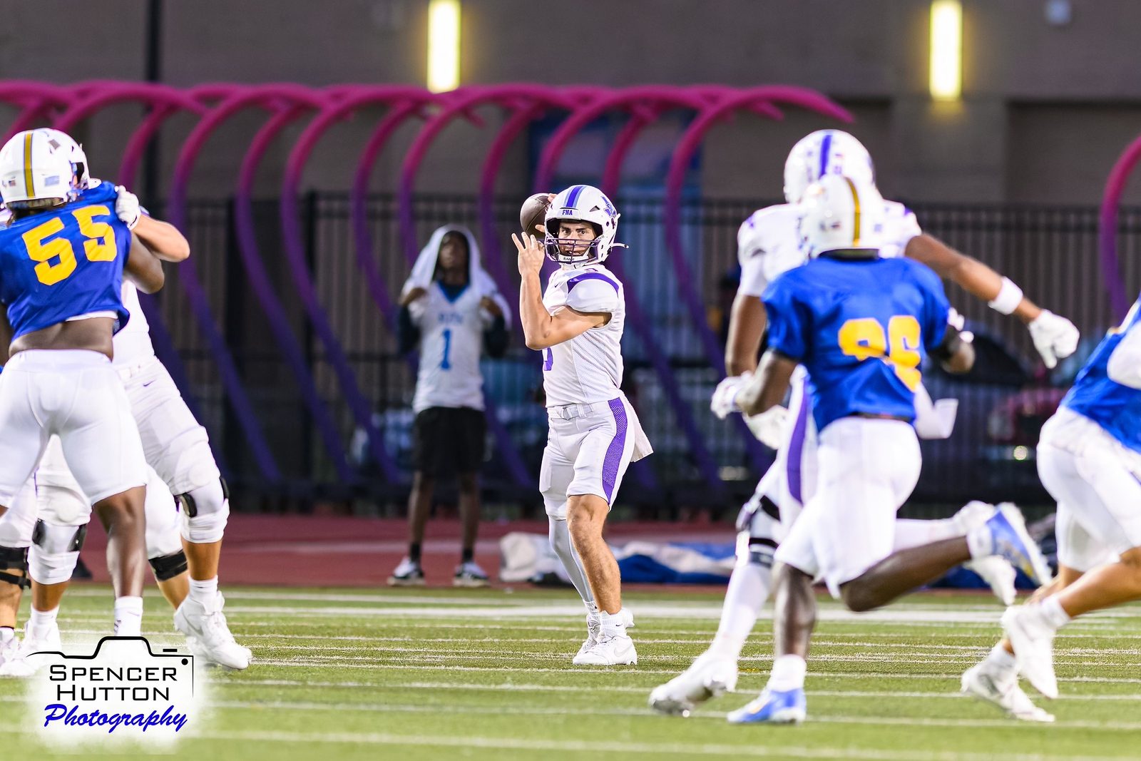 Jace Hanks releases a pass as the Klein rush closes in