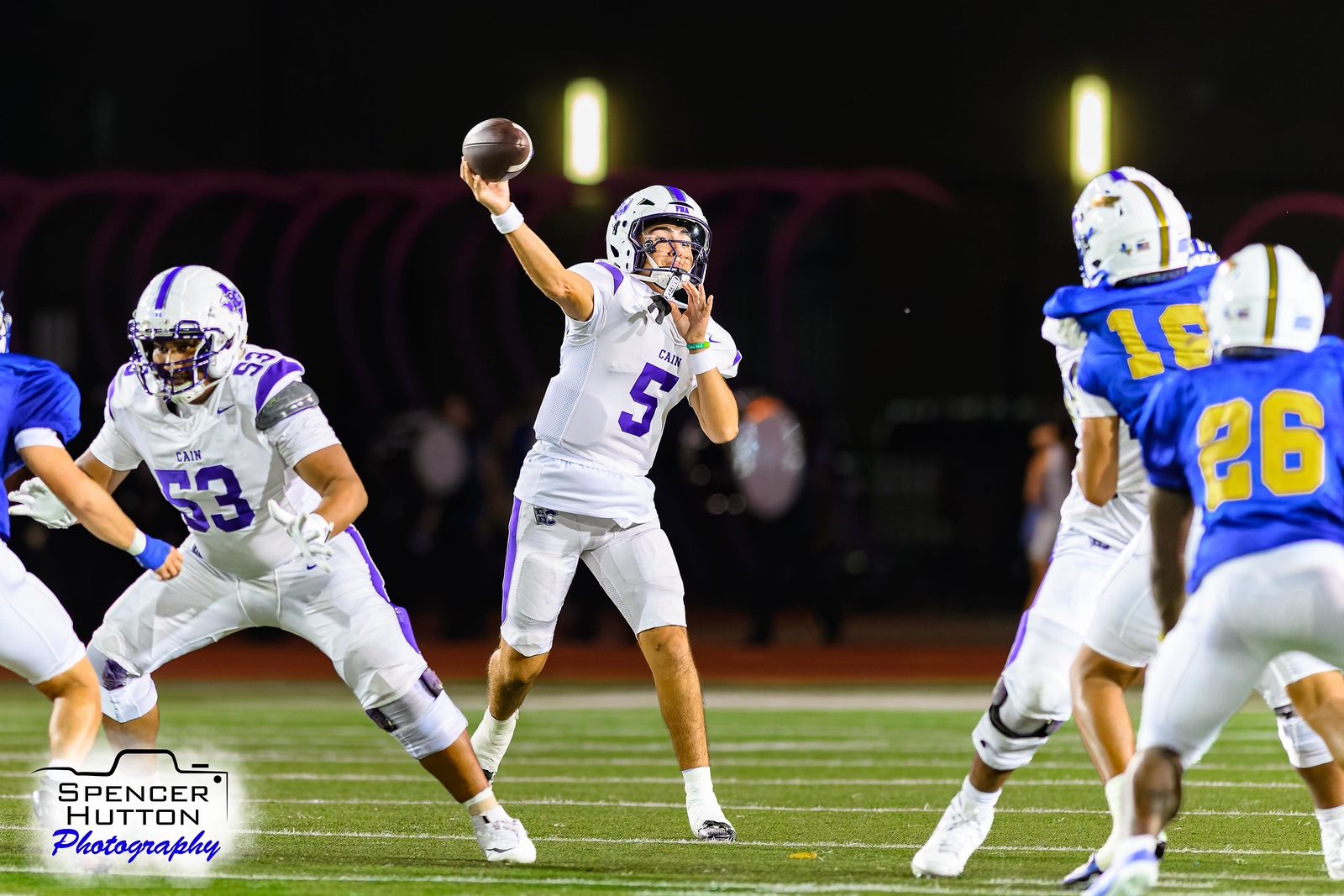 Trey Reyes releases a pass under the lights