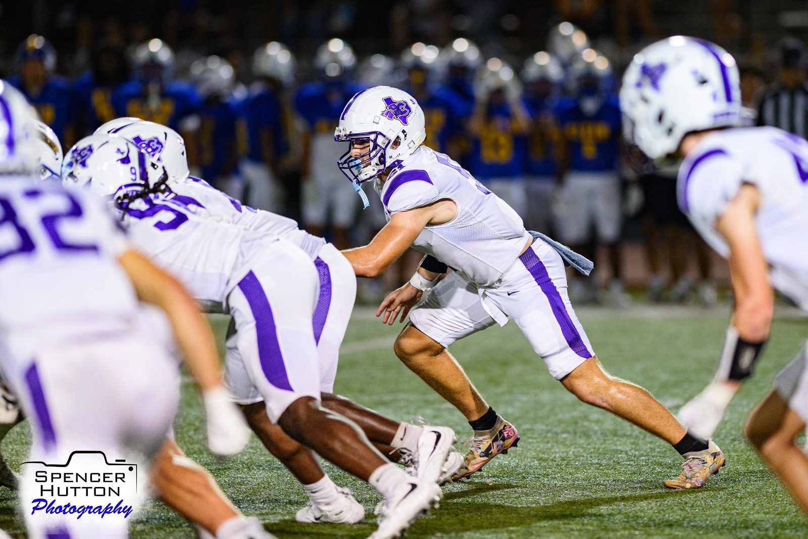 Cain linemen drive forward at the line of scrimmage