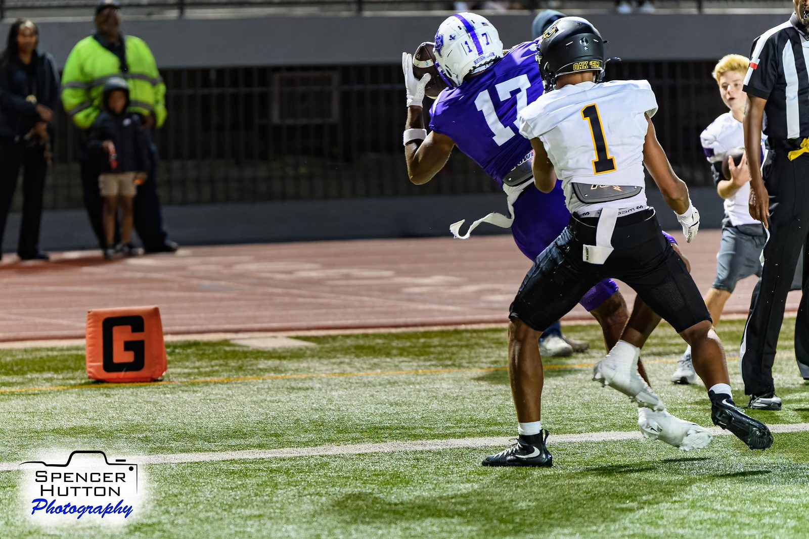 Tyson Freeman hauls in a touchdown catch at the goal line against Klein Oak