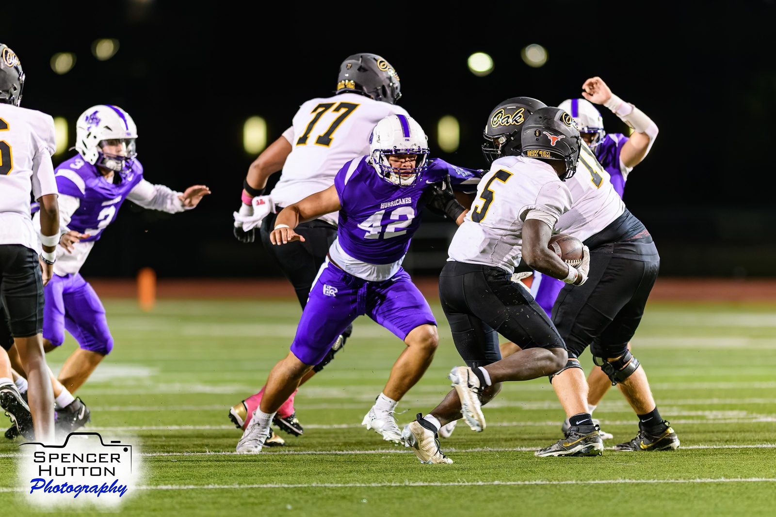 Jaemin Gilstrap closes in on Micah Rhodes as Klein Oak runs the ball