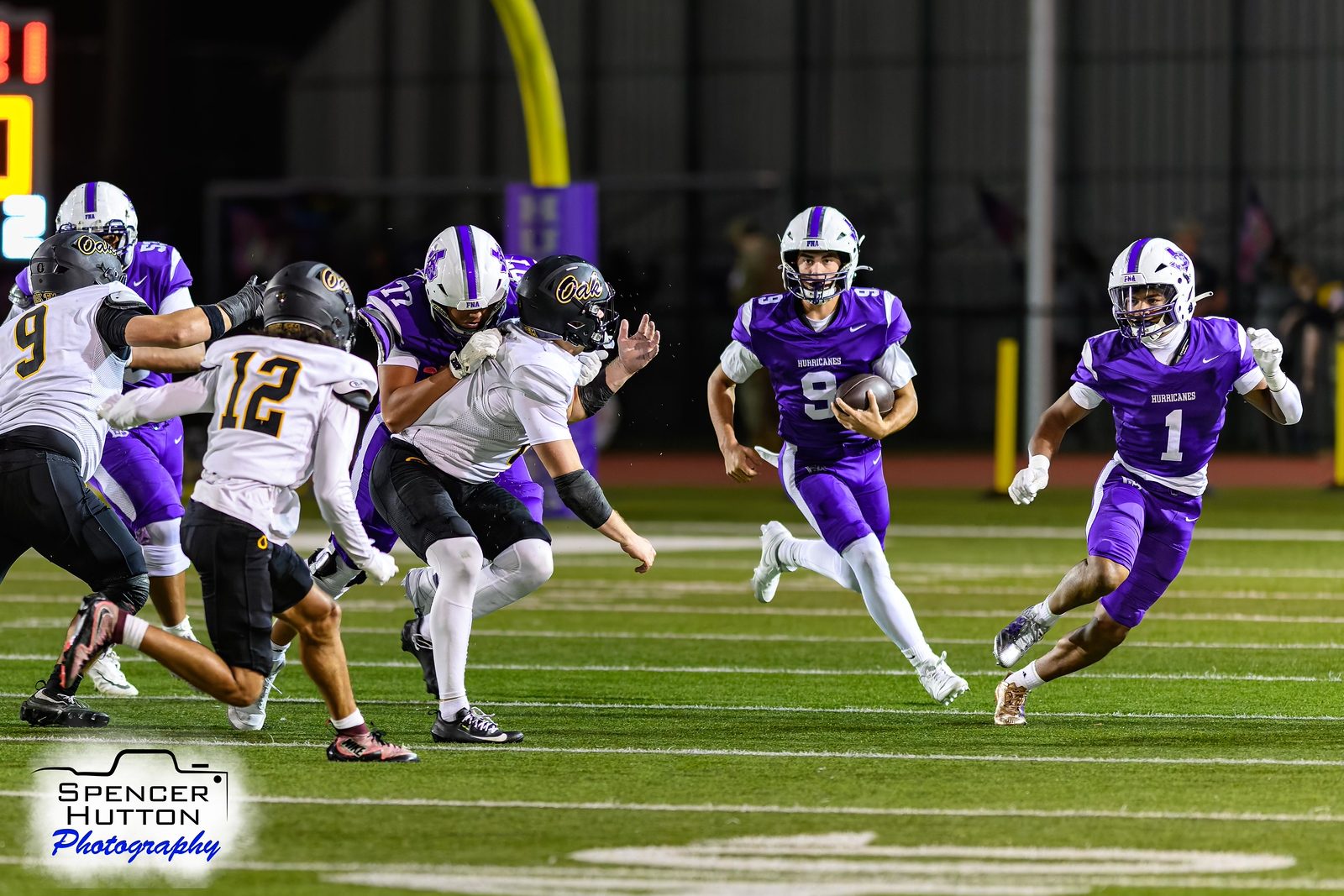 Jace Hanks keeps the ball and breaks into the open field with Earl Oguinn Jr. alongside